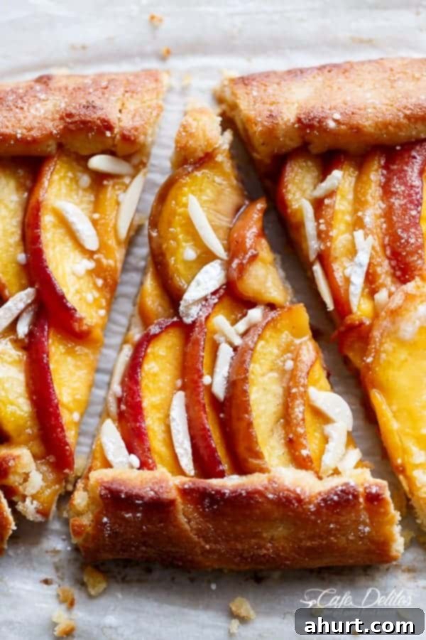 Low Carb Almond Peach Pie with Vanilla Bean Mascarpone Cream 2 Close-up image of a beautifully baked Almond Peach Pie with Vanilla Bean Mascarpone Cream, showcasing its golden crust and juicy peach filling.