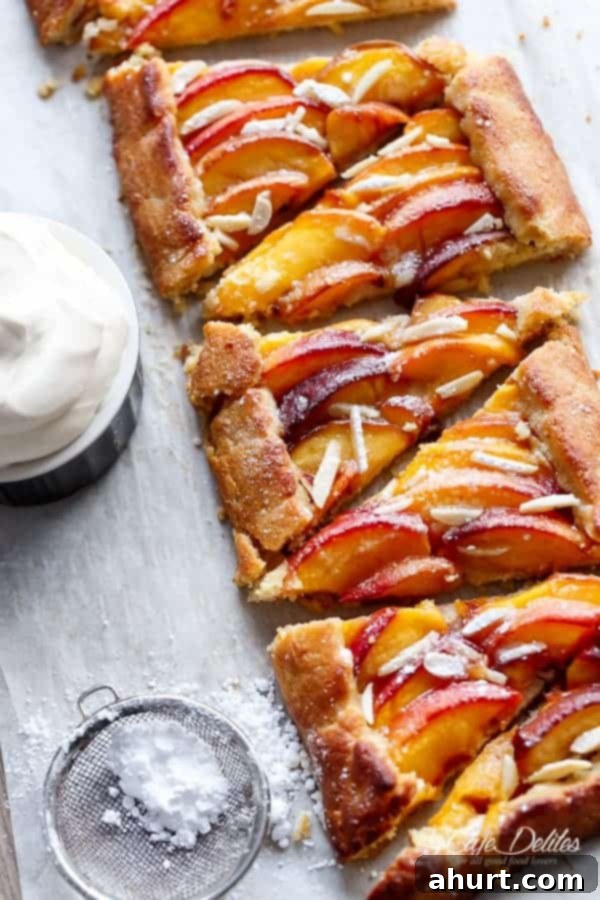 Low Carb Almond Peach Pie with Vanilla Bean Mascarpone Cream 4 Full view of an Almond Peach Pie with Vanilla Bean Mascarpone Cream, showing its rustic edges and beautiful golden-brown finish.