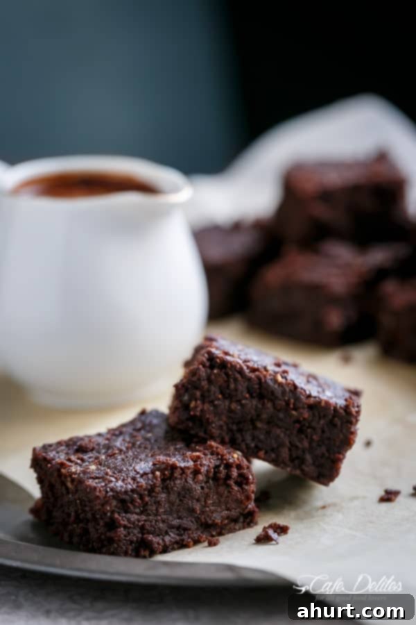 Decadent Low Carb Flourless Hazelnut Brownies 3 Individual Fudgy Flourless Hazelnut Brownie pieces on a plate