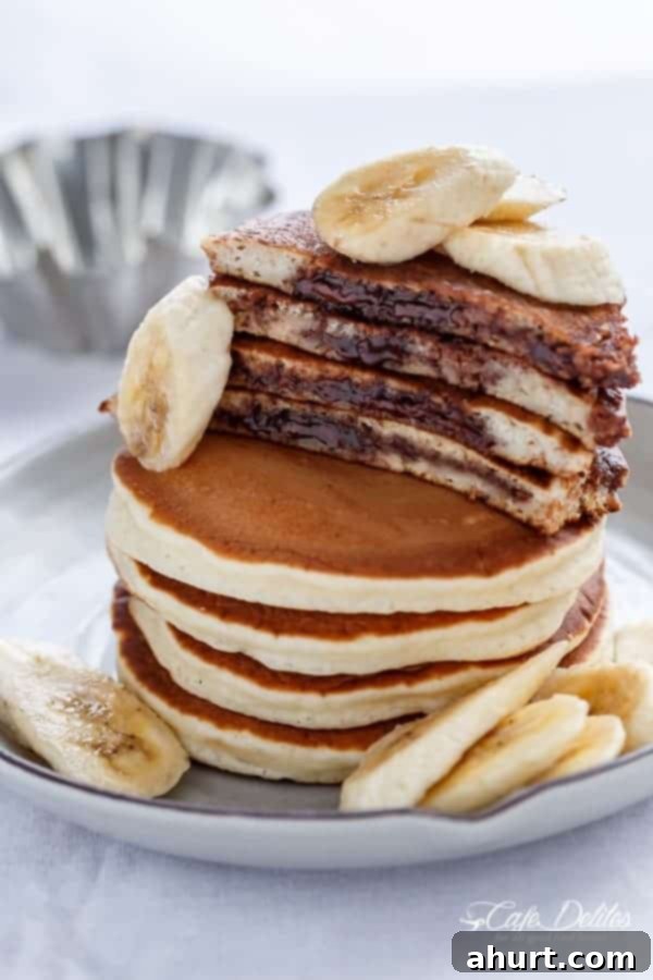 Gooey Nutella Banana Pancake Bliss 7 Nutella Stuffed Banana Pancakes with banana slices