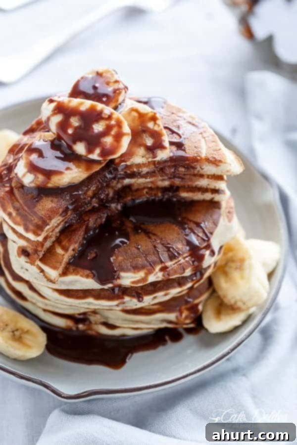 Gooey Nutella Banana Pancake Bliss 8 Nutella Stuffed Banana Pancakes on a plate