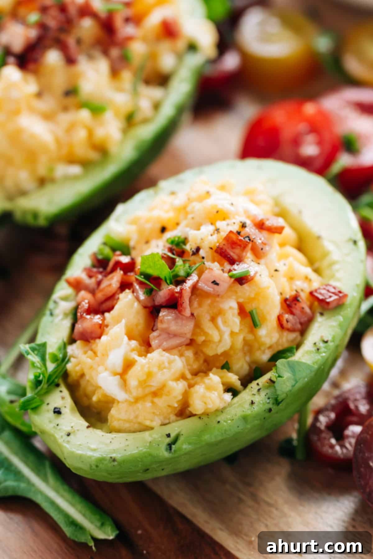 Avocado Scrambled Egg Boats 2 Yummy Soft scrambled eggs with stringy cheese and crispy bacon stuffed into avocado