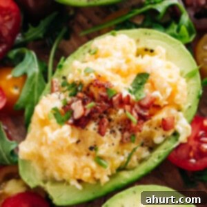 Avocado Scrambled Egg Boats 6 Enjoy Soft scrambled eggs with stringy cheese and crispy bacon stuffed into avocado
