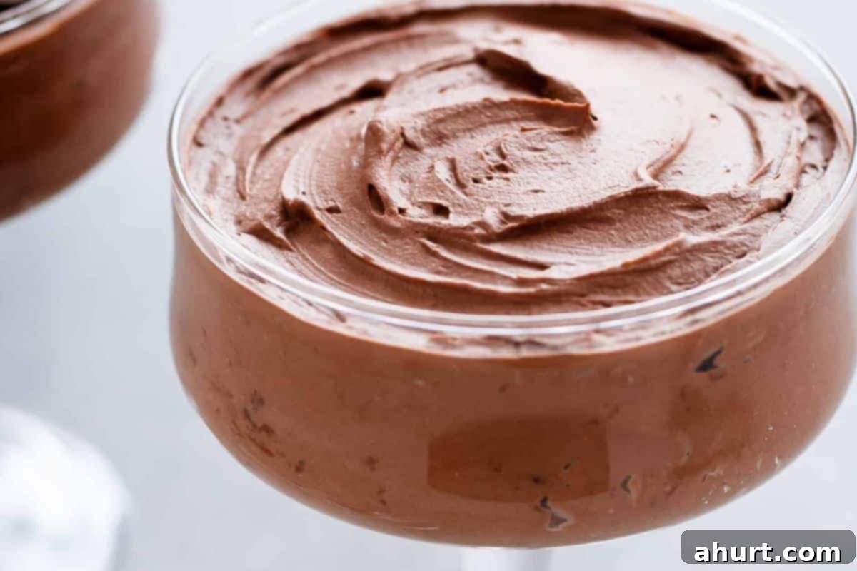 Effortless Double Chocolate Indulgence 7 Portion the mousse into cups and chill until set. Top with reserved whipped cream and with chocolate shavings.