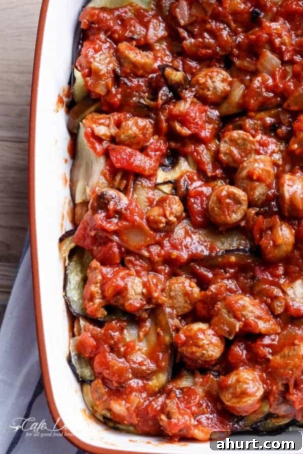 Top view of Sausage Eggplant Lasagna With Ricotta Pesto, showcasing the beautiful layers before baking.