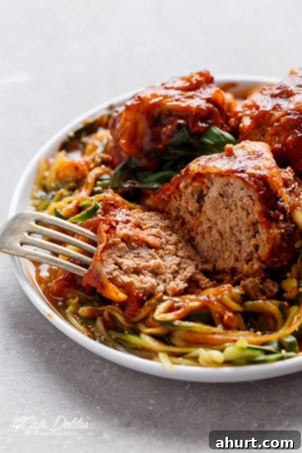 Fork pierced in Sundried Tomato Cheesy Meatballs