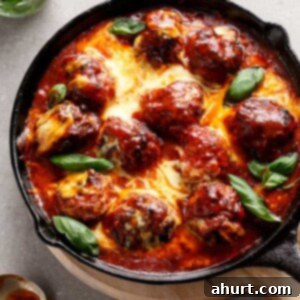 Savory Low Carb Sun Dried Tomato Cheesy Meatballs 9 Sun Dried Tomato Cheesy Meatballs in a pan