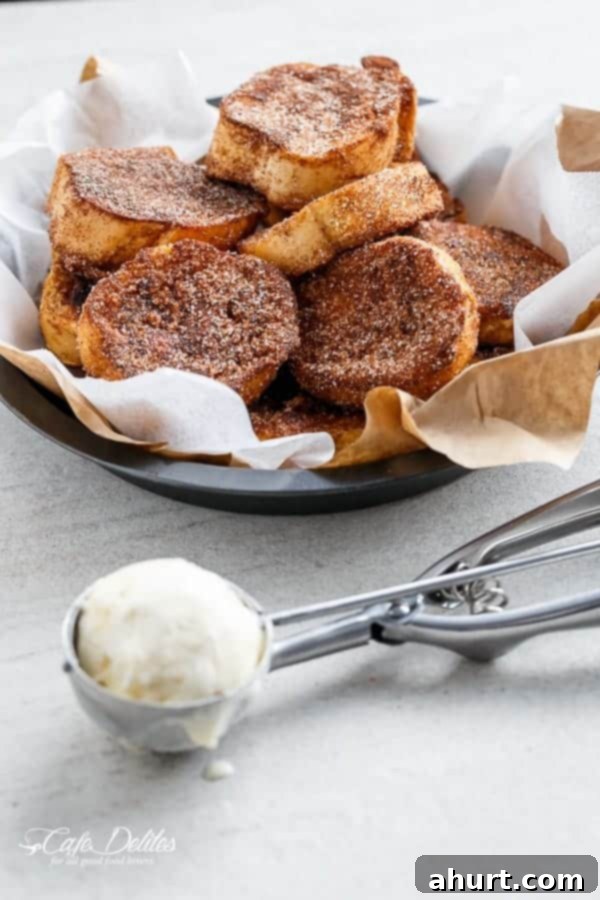 Decadent Churro French Toast Ice Cream Sandwich 3 Close-up of golden Churro French Toast in a bowl, ready to be assembled into a sandwich.