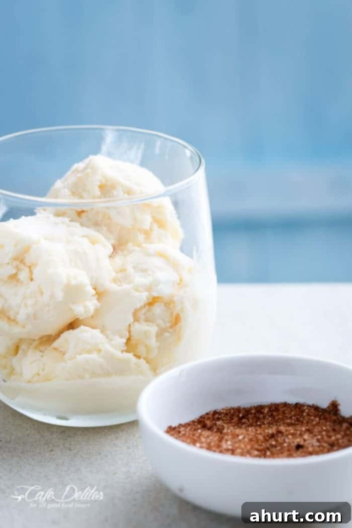 Decadent Churro French Toast Ice Cream Sandwich 4 Ice cream in a glass with crispy churro pieces, showcasing the texture and appeal of churro crunch.