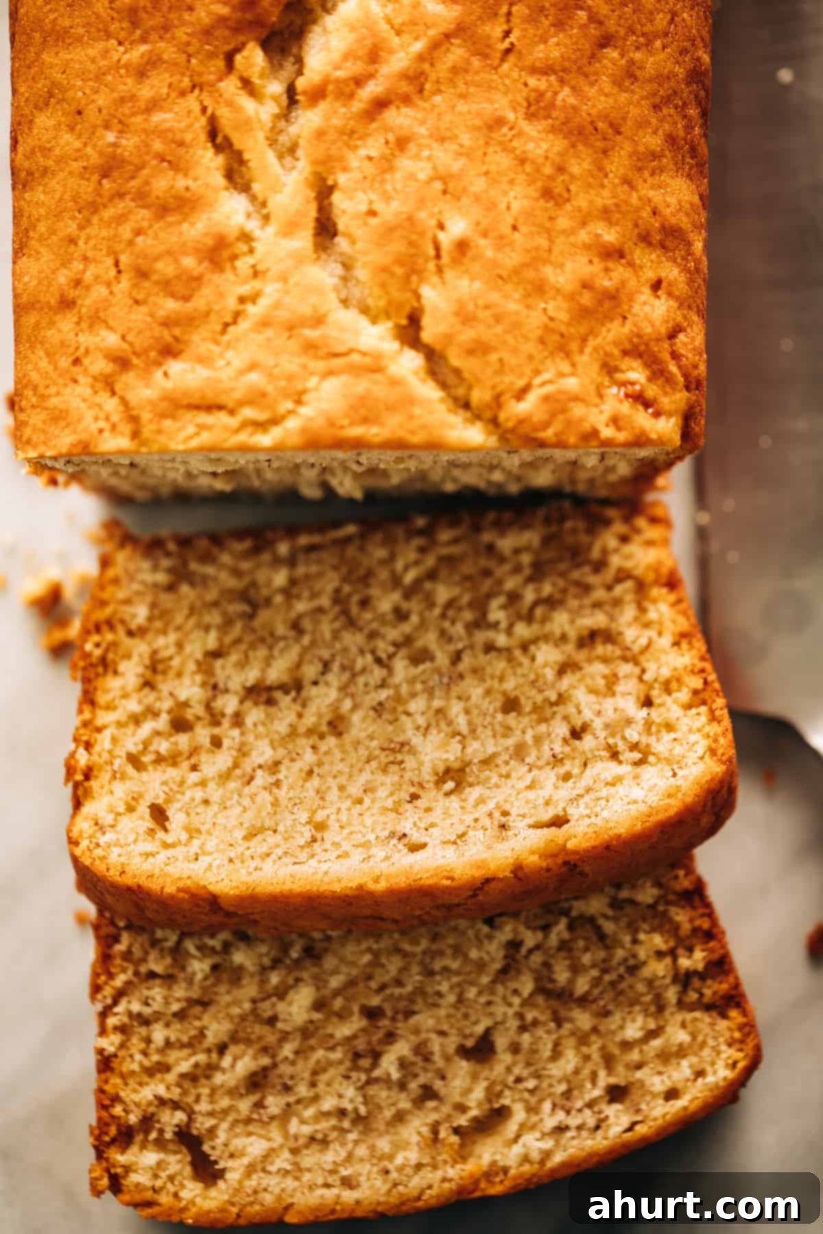 Golden Banana Maple Spice Cake 2 Top view image of A Banana Cake sliced into two slices, showcasing its moist texture.