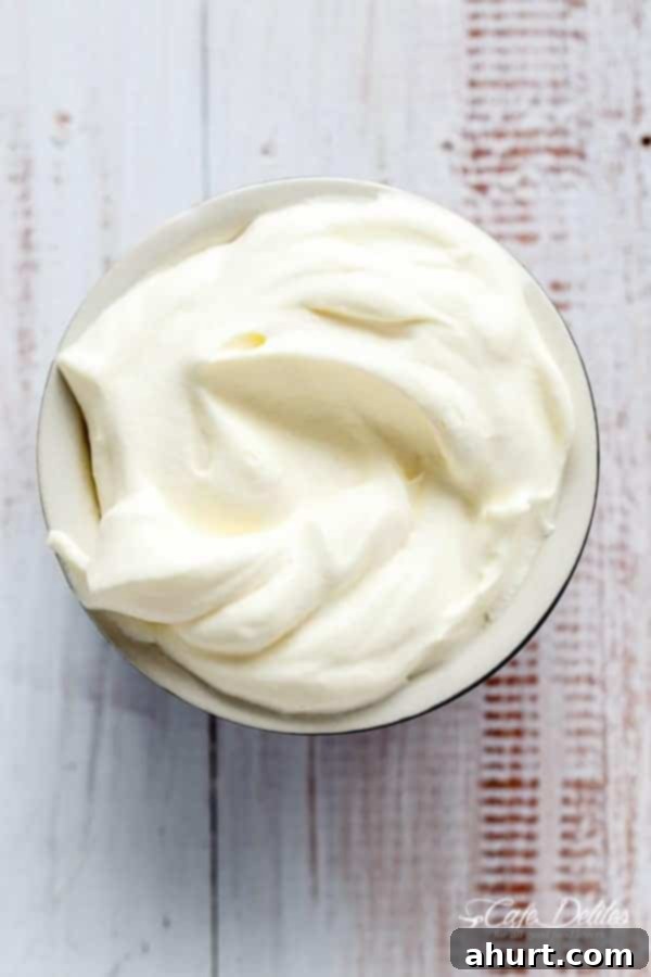 Cloud-Like Coconut Topping 2 Two-Ingredient Dairy-Free Coconut Whipped Cream in a bowl, ready to be served