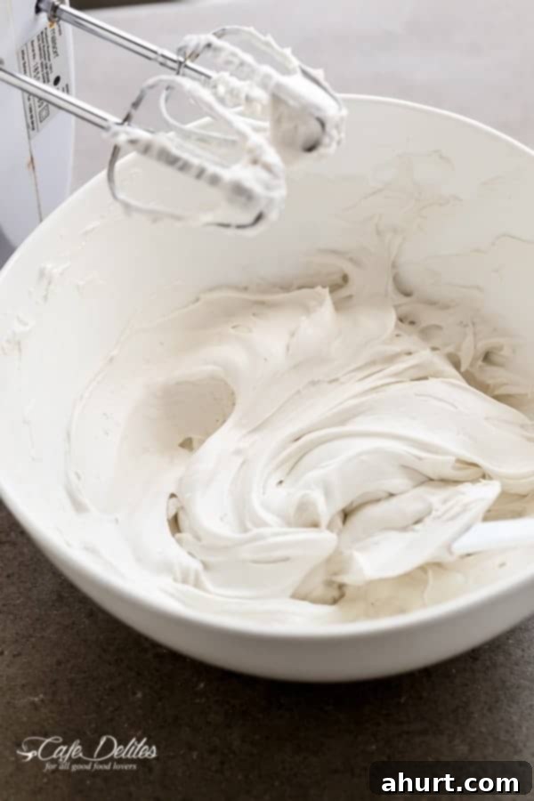 Cloud-Like Coconut Topping 4 Beating coconut cream with a hand mixer to create whipped cream