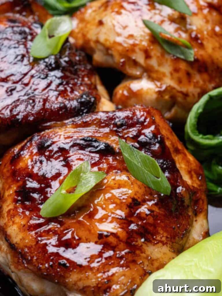 Caramelized Asian Glazed Chicken Thighs 8 Zoom in image of Roasted Asian Glazed Chicken Thighs, perfectly cooked and garnished