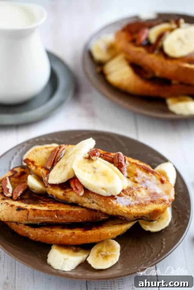 Banana Bread French Toast with a Cream Cheese Glaze on a plate