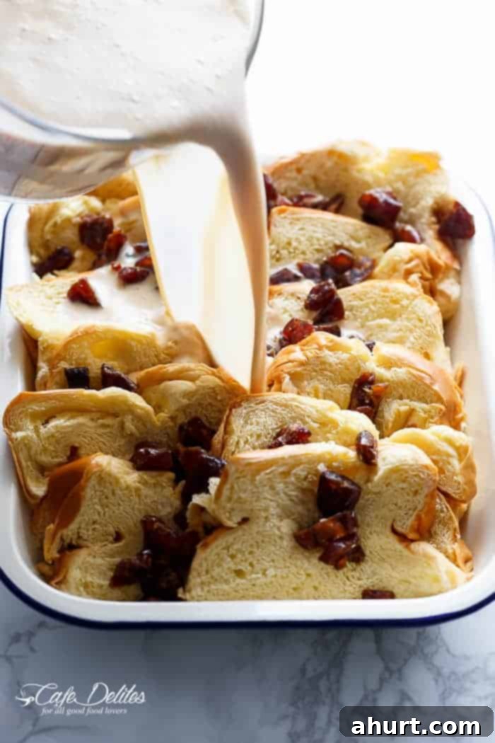 A dressing pouring over French Toast Bake 