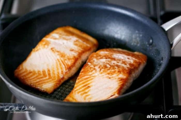 Grilled Salmon cooking in a pan