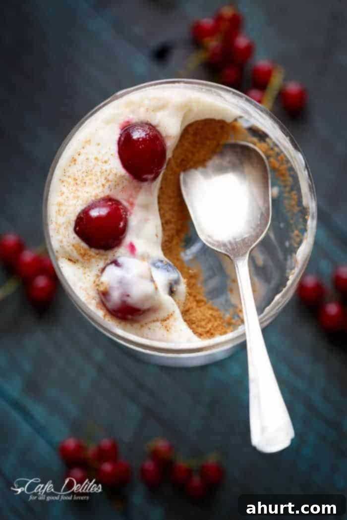 Effortless Eggnog Berry Cheesecakes 8 A piece taken from No Bake Eggnog Berry Cheesecakes