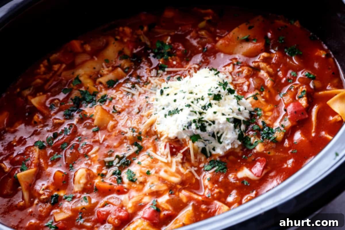 Cozy Slow Cooker Lasagna Soup 4 Lasagna Soup with some shredded cheese