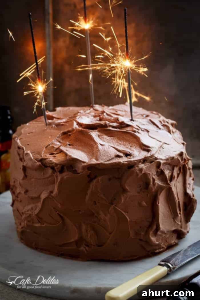Butter Cake with Kahlua Chocolate Cream Frosting adorned with sparklers for a festive celebration.