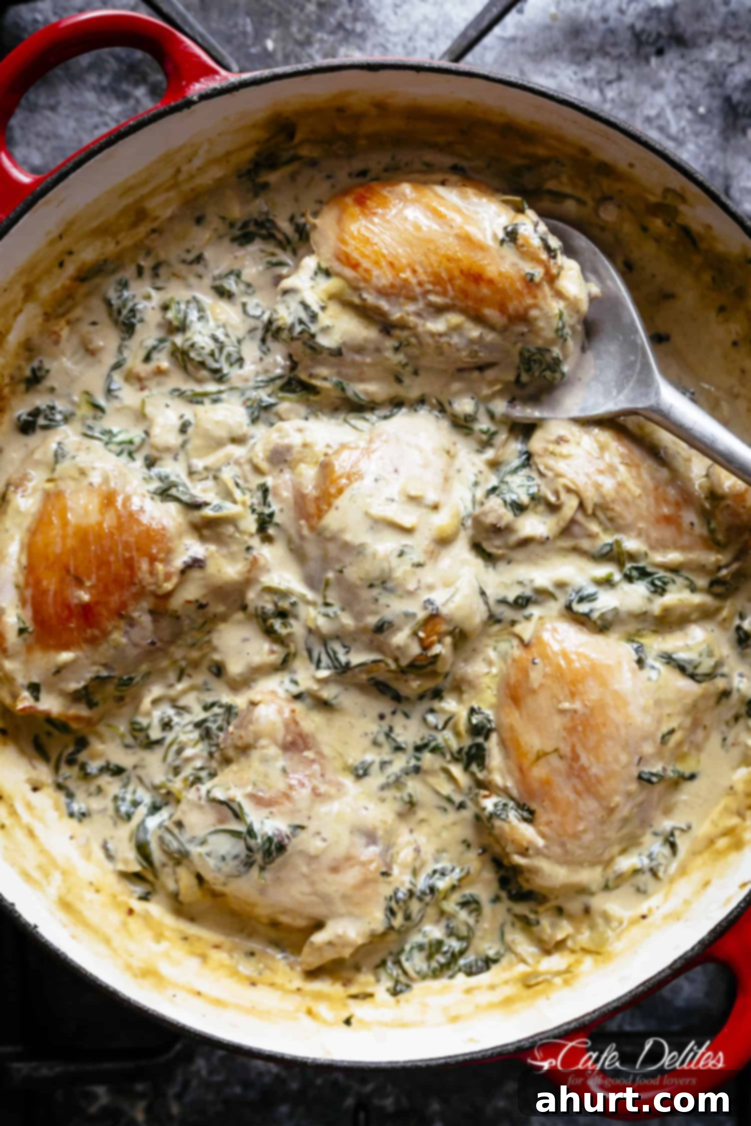 Creamy Spinach Artichoke Chicken Thighs in one skillet! Low fat and low carb, filled with fresh spinach, artichokes, parmesan cheese and a hint of garlic! 