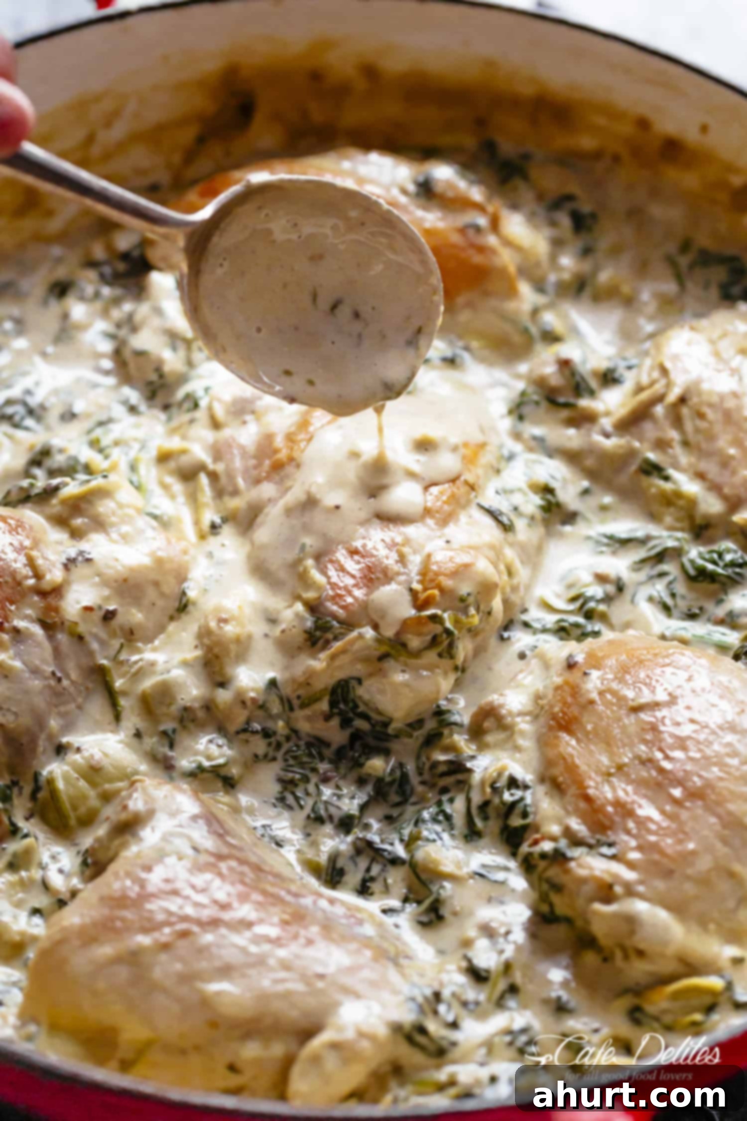 Creamy Spinach Artichoke Chicken Thighs in one skillet! Low fat AND low carb, filled with fresh spinach, artichokes, parmesan cheese and a hint of garlic! 
