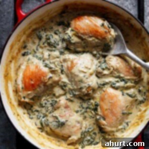 Decadent Creamy Spinach Artichoke Chicken Thighs 6 Creamy Spinach Artichoke Chicken Thighs in a pan