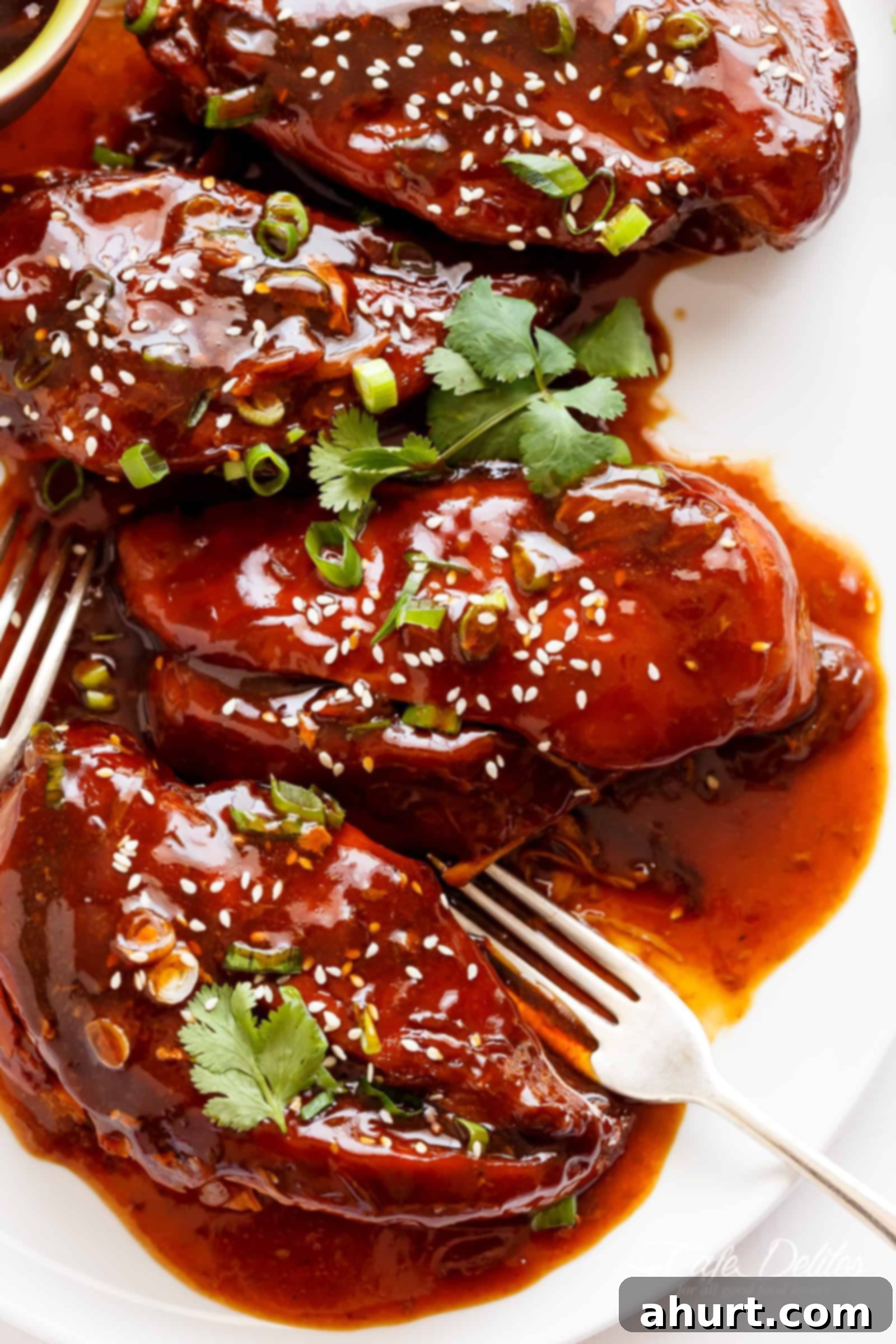 Mouthwatering Slow Cooker Asian Glazed Chicken Breasts or chicken thighs cooked to perfection, ready to be served over rice.