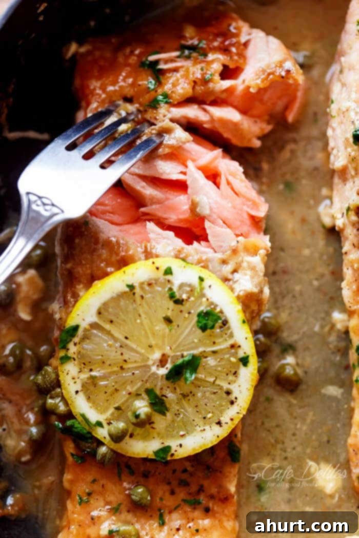 Quick Lemon Caper Salmon 12 Image focusing on inner part of Easy Salmon Piccata with all of the authentic Piccata flavours of white wine, capers, lemon and garlic.