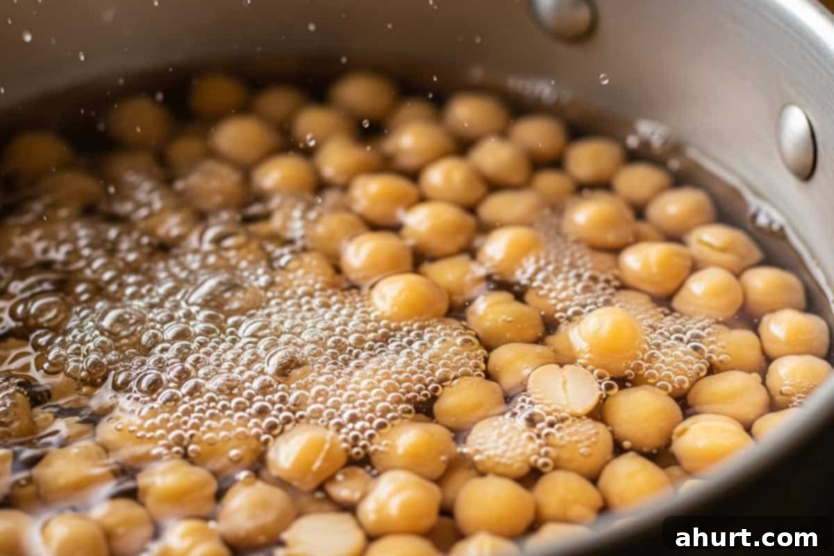 Creamy Avocado Hummus 4 Chickpeas in a pot, covered with water and baking soda, ready to be boiled.