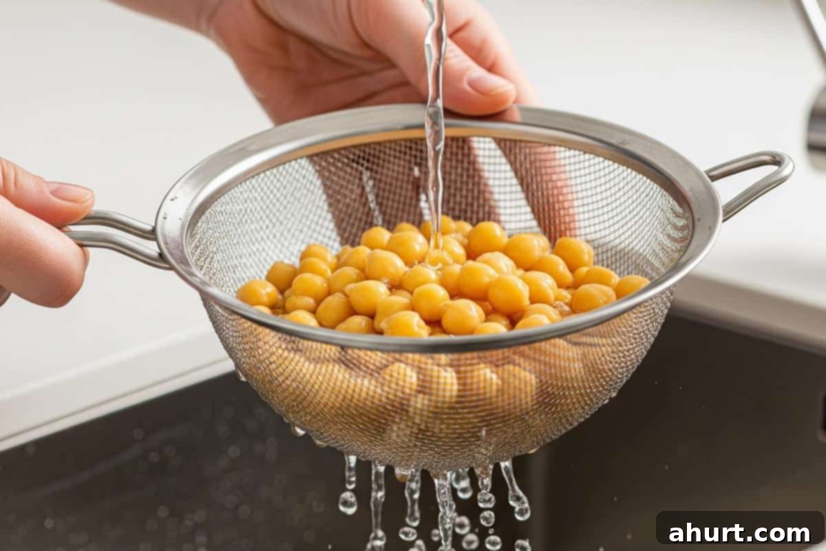 Creamy Avocado Hummus 5 Rinsing the boiled chickpeas in a fine mesh strainer under cool running water.