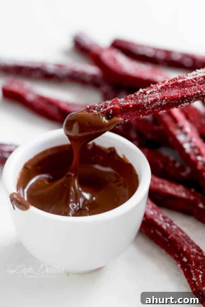 The Best Red Velvet Churros dipped in chocolate sauce 