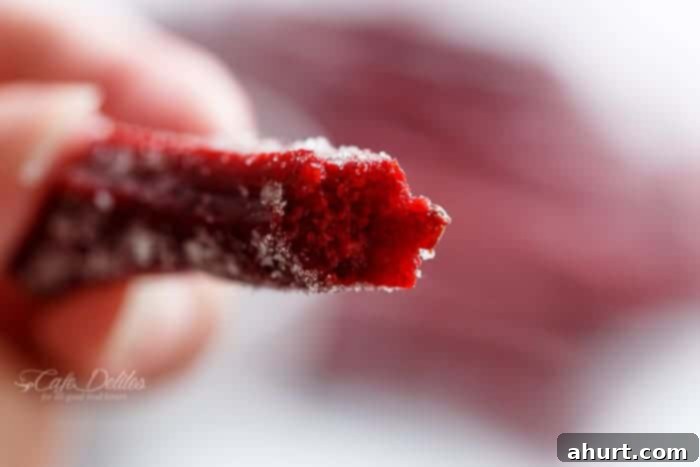 crunchy The Best Red Velvet Churros in hand