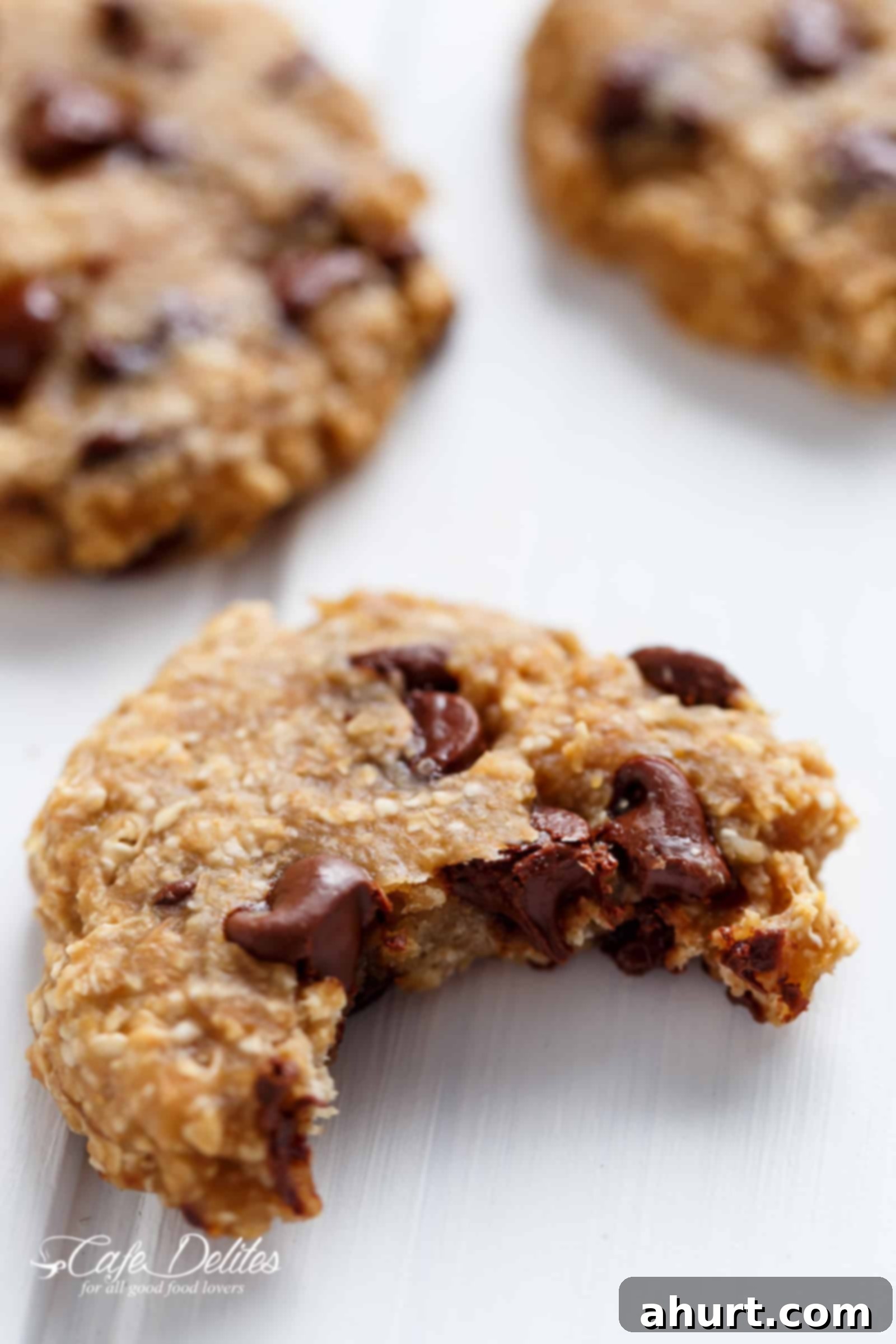 Healthy 2 Ingredient Breakfast Cookies 7 Close-up of a breakfast cookie with a bite missing and chocolate melting from inside.