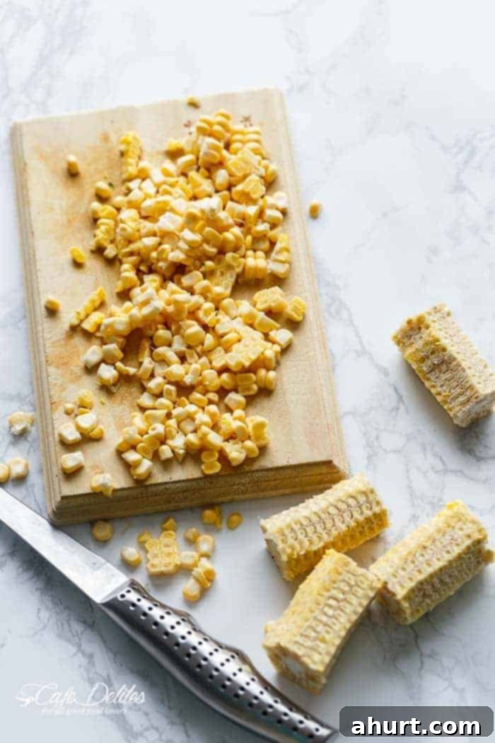 Toasted corn kernels, sweet and slightly charred, prepared for the Chipotle Lime Carnitas Salad.