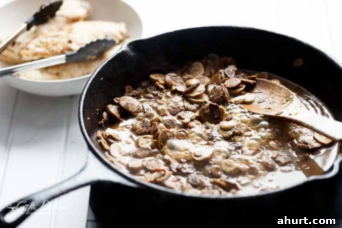 Making of Julia Child\'s Creamy Chicken + Mushroom in a pan