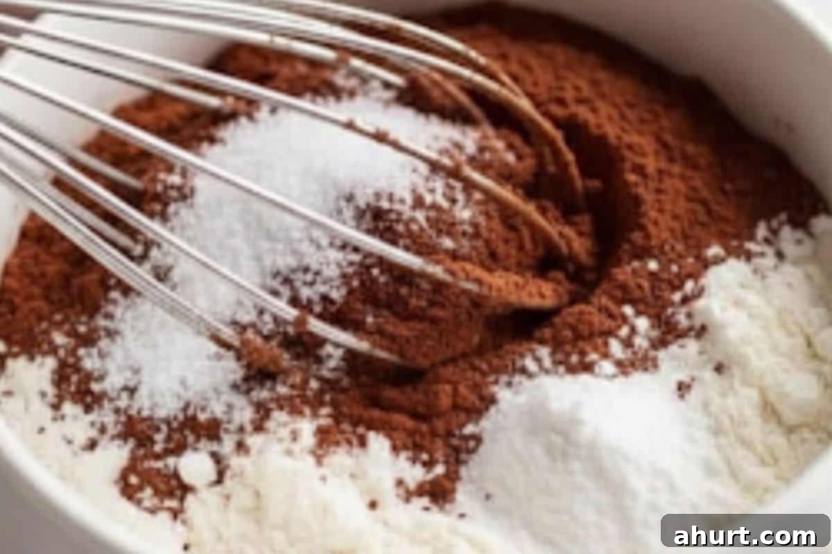 Guilt-Free Chocolate Mug Cake 4 Lightly spray a 1/2 cup mug with cooking oil. Add self raising flour, sweetener, cocoa, baking powder, and a pinch of salt and then whisk to combine thoroughly.