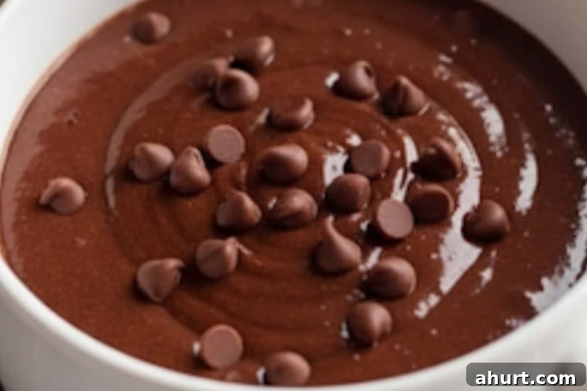 Guilt-Free Chocolate Mug Cake 5 Stir in melted butter, milk, and vanilla until the batter is smooth and glossy. Fold in 1/2 tablespoon mini chocolate chips for extra indulgence.