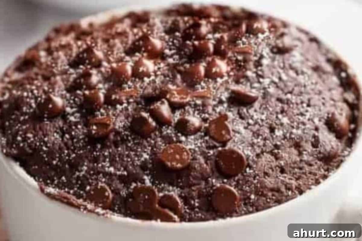 Guilt-Free Chocolate Mug Cake 6 Microwave on High for 40 seconds, then gently touch the top to check doneness, cooking in short bursts if needed to achieve perfect doneness.