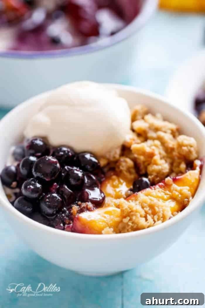 Easy Mango Blueberry Crumble with an ice cream scoop