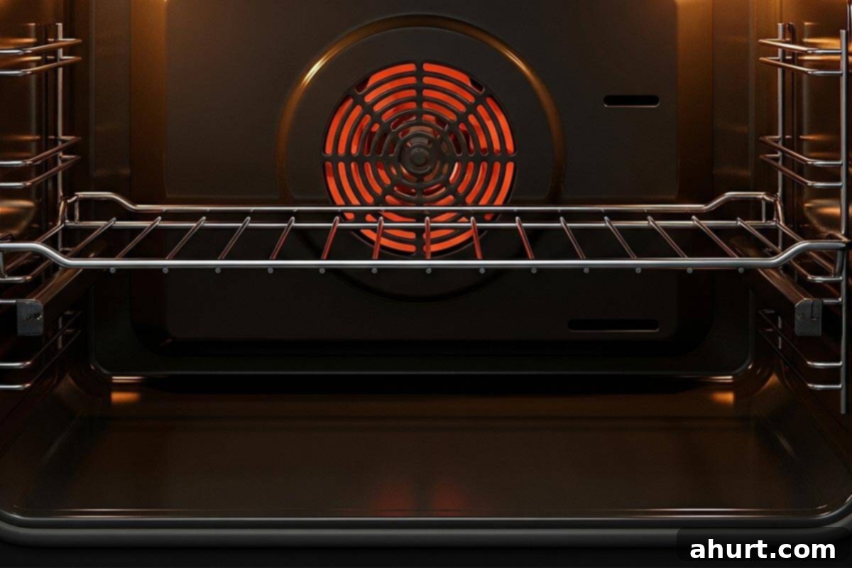 Chicken Mozzarella 4 A kitchen oven's broiler element glowing orange, indicating it's preheated and ready for broiling.