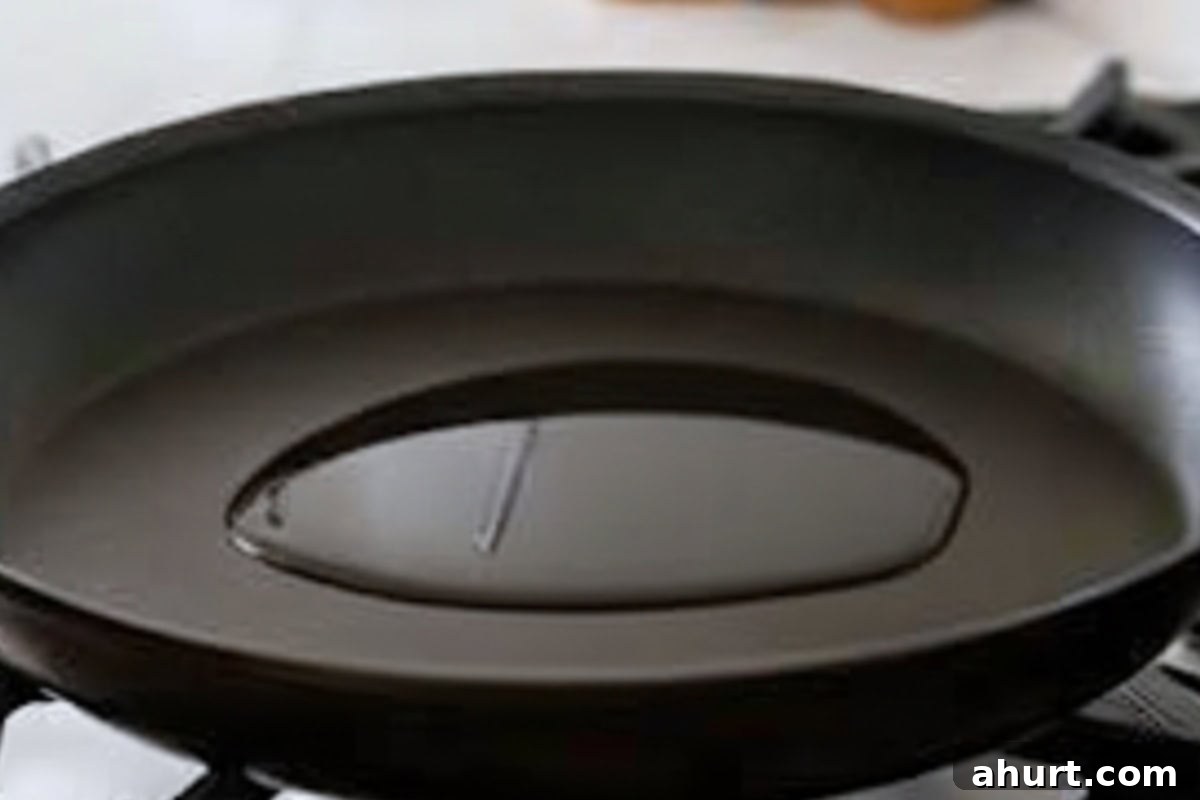 Lightly add cooking oil into the pan and wipe with a paper towel.