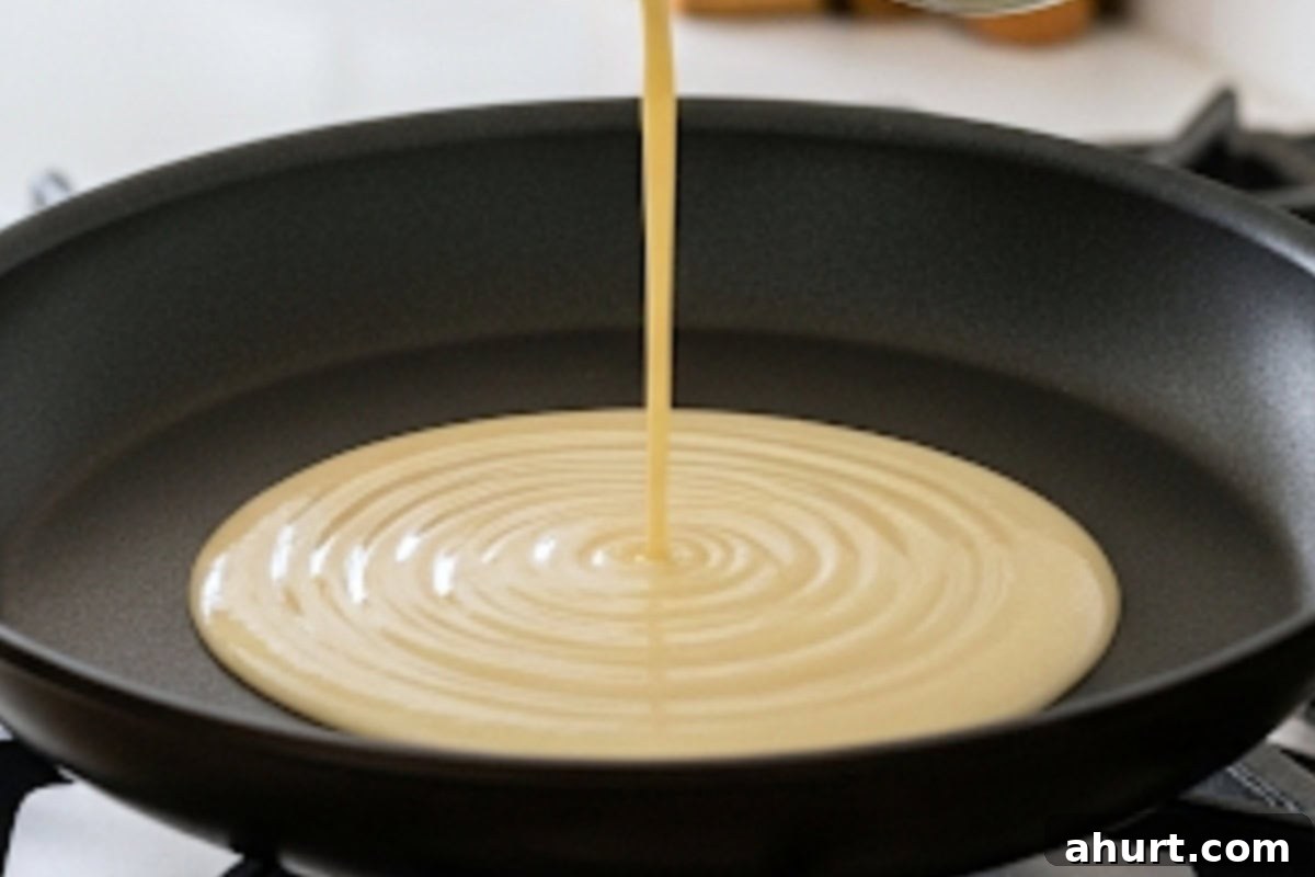 Add 1/4 cup batter in the pan.
