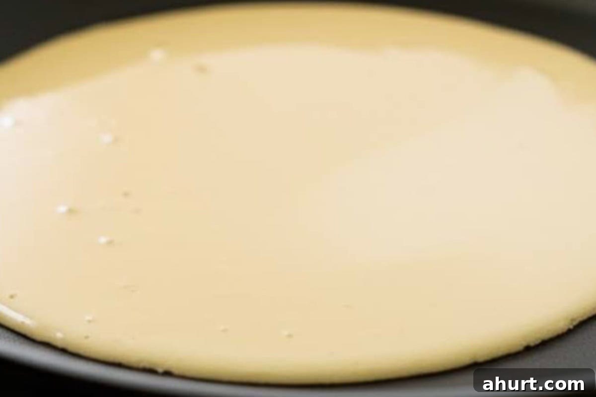 Cook until the surface is set and the edges turn golden.