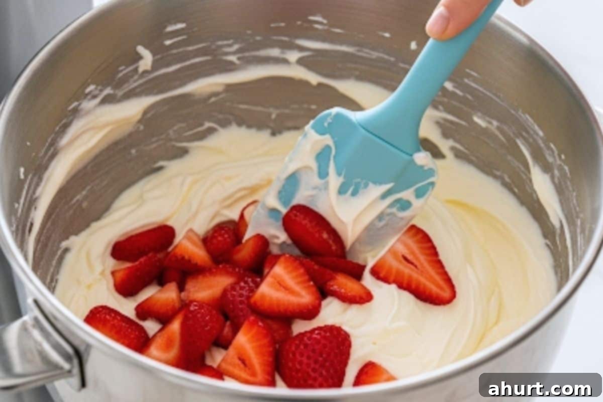 Beat the cream cheese, yogurt, sweetener, lemon juice and vanilla until smooth and creamy. Fold some of the sliced strawberries into the filling. 