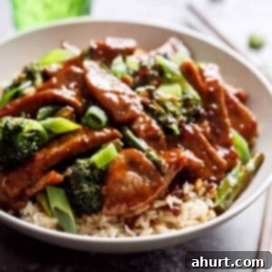 Extra Saucy Mongolian Beef and Broccoli 13 Mongolian Beef And Broccoli with rice in bowl