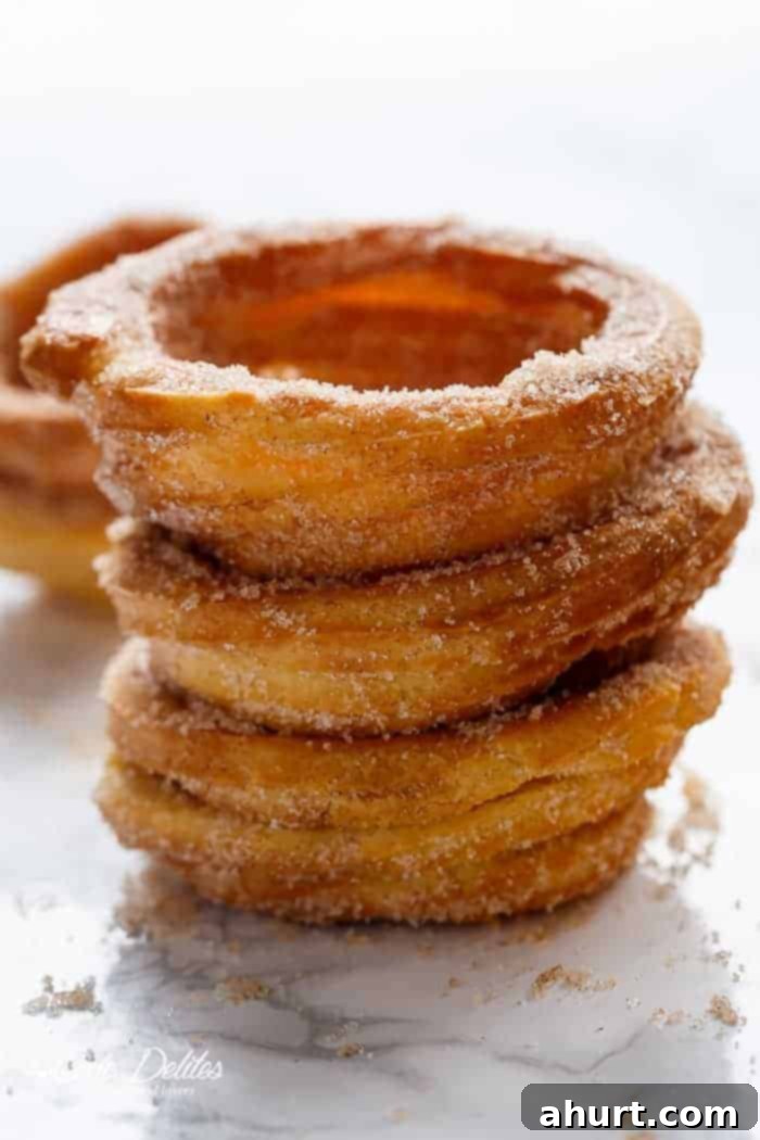 Homemade Churro Bowls stacked on each other, ready for filling with ice cream