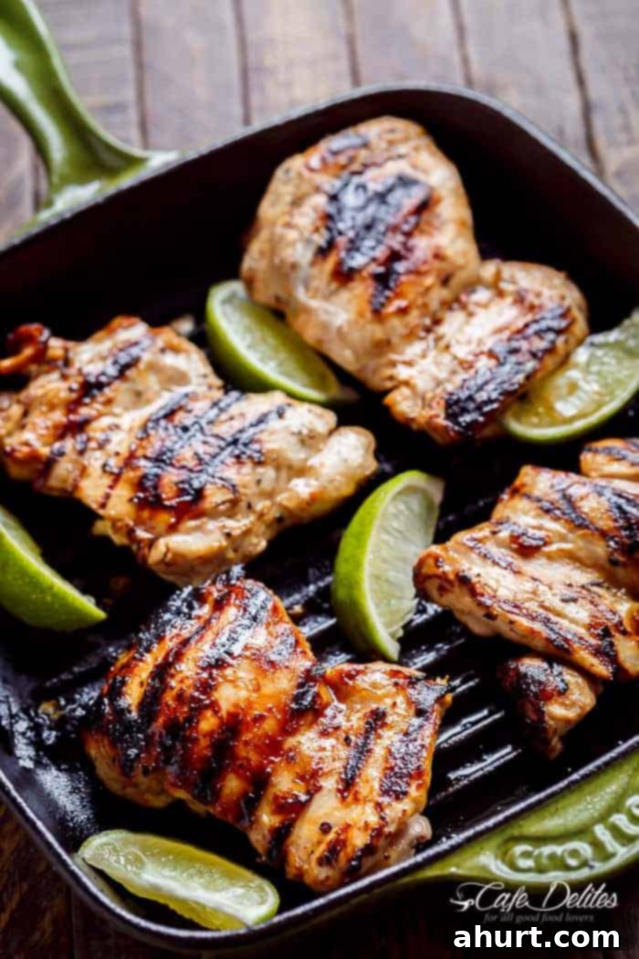 Tequila Lime Grilled Chicken Taco Bowl 4 Grilled Chicken pieces with lemon wedges in a griller