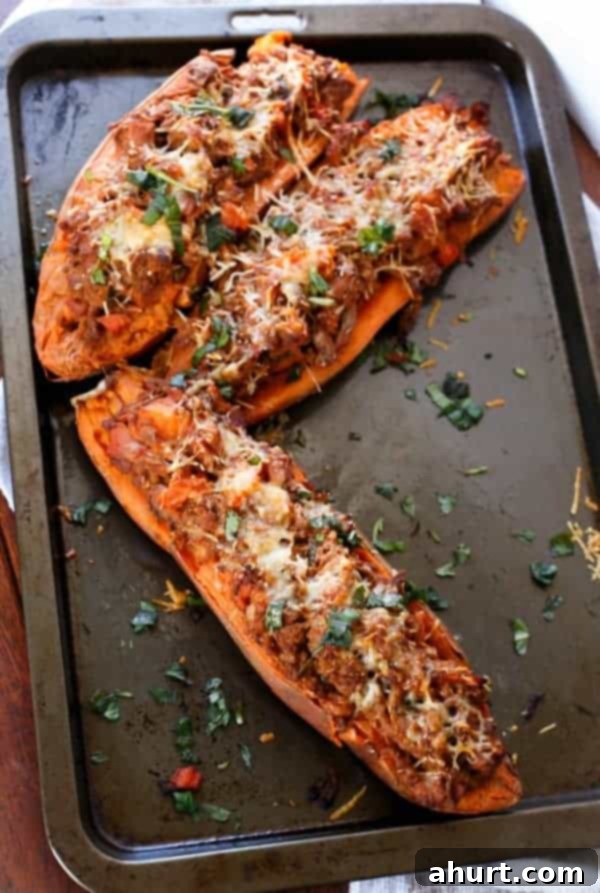 Sweet Potato Boats with Cheesy Bacon Bolognese 3 3 Bacon Bolognese Stuffed Sweet Potatoes on a baking tray