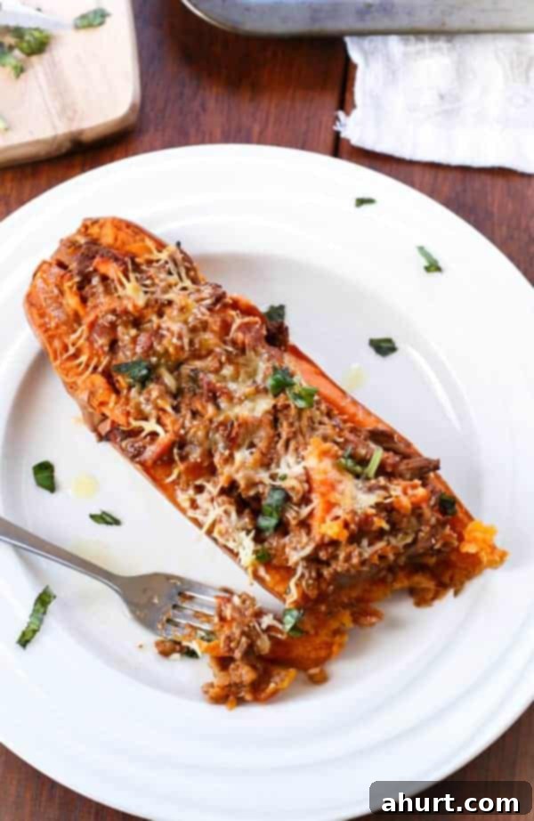 Sweet Potato Boats with Cheesy Bacon Bolognese 4 A piece taken from Bacon Bolognese Stuffed Sweet Potatoes