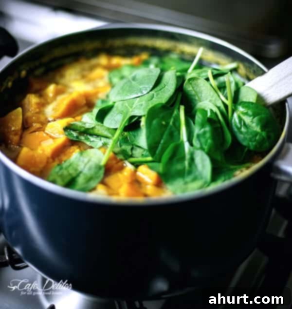 Golden Pumpkin Velouté with Spinach Ribbons and Crispy Bacon Crumble 5 Creamy Pumpkin and Spinach Soup in a pot being cooked